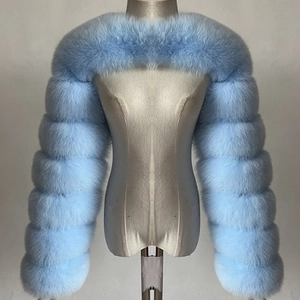 Close-up of light blue faux fur bolero shrug featuring thick segmented plush texture
