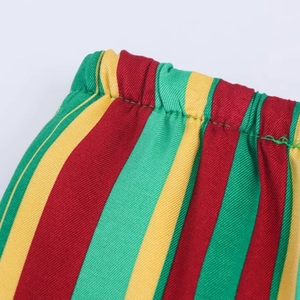 Detailed macro view of elasticated waist and red green yellow striped twill fabric