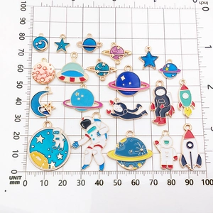 Detailed assortment of enamel space charms including rockets and astronauts for DIY jewelry