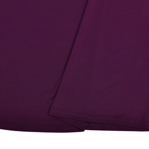 Close-up of purple knit fabric texture and high-quality hem stitching on backless dress