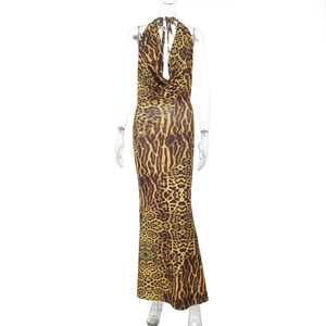 Detail of leopard print halter neck maxi dress with deep V-neckline and slim fit design