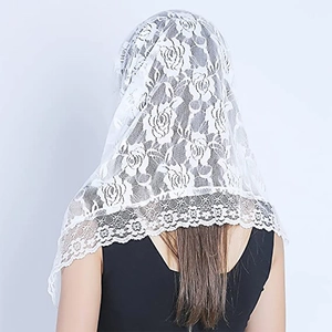 Back view of model wearing a white bridal lace mantilla veil with floral lace trim detail