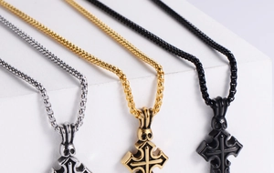Detailed comparison of cross pendants in silver, gold, and black with box chains