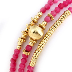 Macro shot of triple-layer bead bracelet with rose chalcedony and textured gold beads