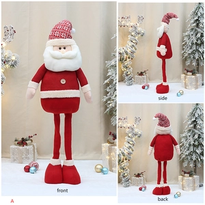 Multi-angle view showing front, side and back details of the plush Santa figurine