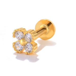 Macro shot of gold S925 silver four-leaf clover stud earring with clear zircons