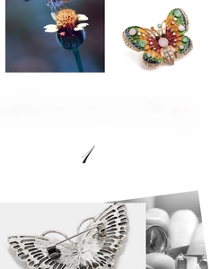 Detailed macro view of butterfly brooch showing colorful enamel wings and crystal inlay