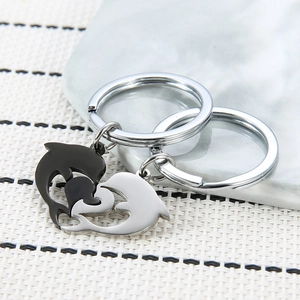 Polished stainless steel heart dolphin keychains in black and silver for couples