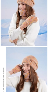 Detailed knit texture of colorful mixed yarn beanie scarf and gloves winter set