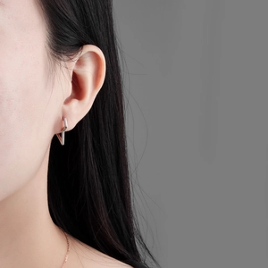 Minimalist S925 silver lightning bolt hoop earrings shown on model for a modern look