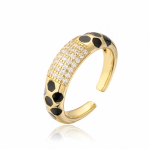 Detailed close-up of adjustable 18K gold ring featuring white zircons and leopard enamel