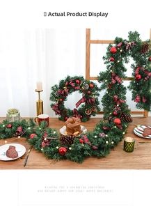 Close-up of 2.7m Christmas garland with red tartan bows, pine cones, and warm LED lights