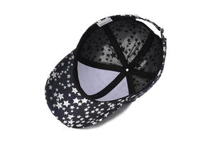 Detailed interior of the star-printed baseball cap showing sweatband and 100% polyester label