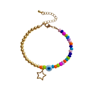 Bohemian 18K gold plated bead bracelet with colorful beads and star charm on white background