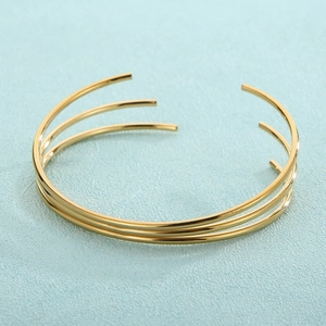 Minimalist gold-plated triple-layer open bangle with polished stainless steel finish