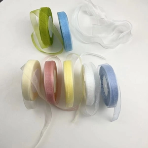 Close-up of multi-color semi-transparent organza ribbons for gift wrapping and floral crafts
