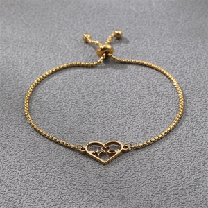 Detailed view of gold heart and heartbeat charm on an adjustable stainless steel box chain