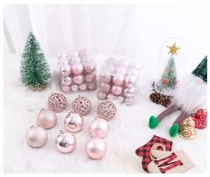 Detail of pink Christmas balls in shiny, matte, and glitter finishes for holiday tree decor