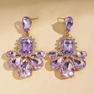 Vintage gold geometric earrings featuring purple crystal teardrops in palace style