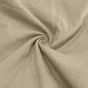 Detailed macro view of beige linen fabric texture and breathable weave for casual shorts