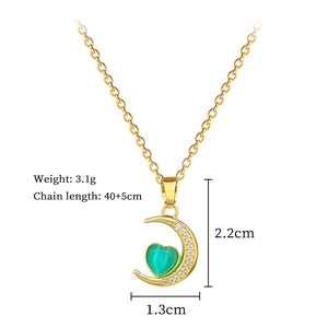 Detail of moon necklace with green heart gem including size 2.2x1.3cm and weight 3.1g