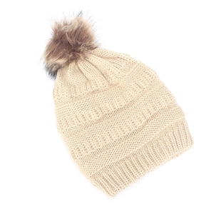 Winter chunky knit beanie with large faux fur pompom and ribbed cuff in beige color