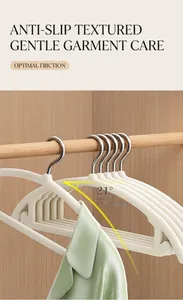 Detail view of non-slip velvet hanger with 21-degree shoulder curve design in beige color