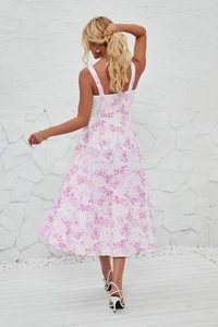 Back view of a white floral sun dress with spaghetti straps and pink flower prints