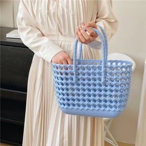 Light blue hollow woven jelly beach basket bag with handles for summer vacation and daily use