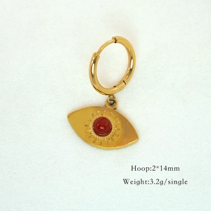 Macro detail of eye pendant earring with red gem, 14mm hoop size and 3.2g weight