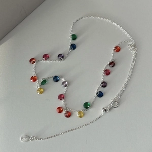 Close-up of S925 sterling silver chain with colorful zircon beads and lobster clasp closure