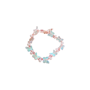 Elegant acrylic butterfly and faux pearl beaded bracelet with pink woven cord