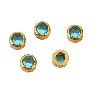 Detail of 6mm gold plated stainless steel beads with inlaid blue zircon stones