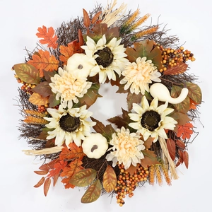 Detailed close-up of Thanksgiving wreath with white pumpkins, sunflowers and maple leaves