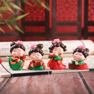 Macro view of 4 cute Tang dynasty lady figurines playing music and dancing