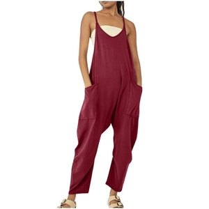 Detailed close-up of loose-fit burgundy jumpsuits featuring large side pockets and spaghetti straps