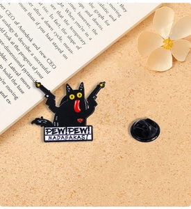 Funny black cat enamel pin with Pew Pew Madafakas slogan and dual pistols detail