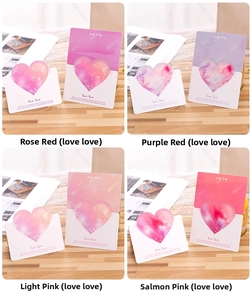 Macro detail of watercolor heart cards in four colors with love love printed text