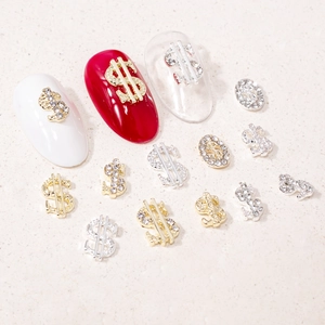 3D dollar sign nail charms with gold and silver finishes and sparkling rhinestones