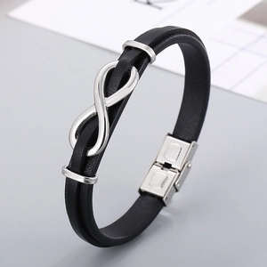 Detail of black braided leather bracelet with silver infinity symbol and metal clasp