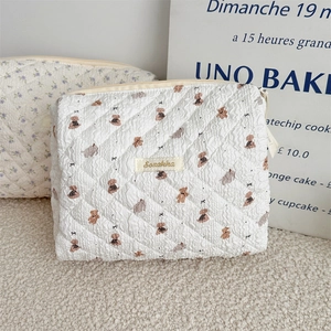 Quilted cotton cosmetic bags with bear embroidery and purple floral pattern design