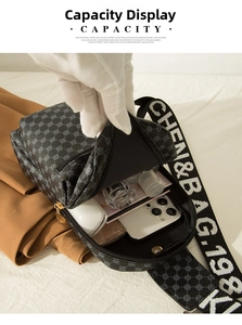 Internal capacity of crocodile pattern chest bag showing storage for phone and cosmetics