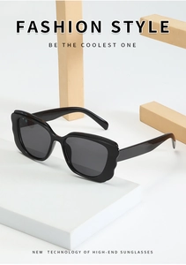 Macro detail of high-end butterfly frame sunglasses with wavy edge design on modern props