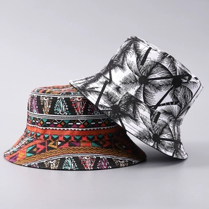 Bucket hats with exotic palm tree and bohemian prints on canvas fabric