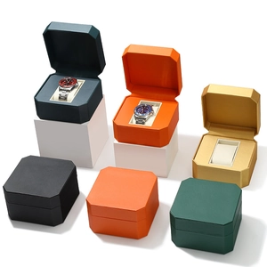 Octagonal PU leather watch display boxes in five colors on white pedestals for storage