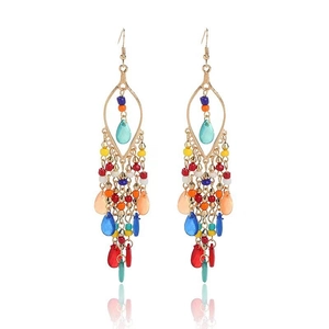 Detail of bohemian long tassel earrings with vibrant multi-colored beads and gold hooks