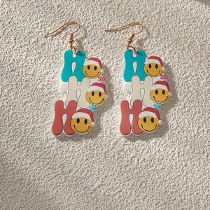 Christmas macaron acrylic earrings with HO HO HO smiley face charms and gold hooks
