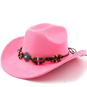 Detail of pink faux suede cowboy hat featuring braided trim and vintage turquoise bead