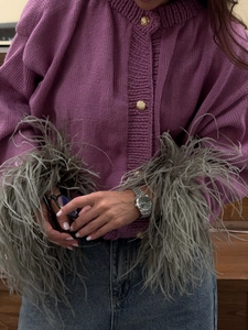 Chic purple chunky knit cardigan with grey ostrich feather cuffs and gold buttons