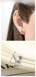 Detail showing paved zircon star stud earring dimensions of 1.09cm by 0.52cm